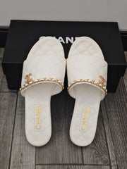White Quilted Slide Sandals with Gold Chain Detail
