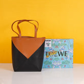 Medium Puzzle Fold Tote in shiny calfskin Warm Desert/Black